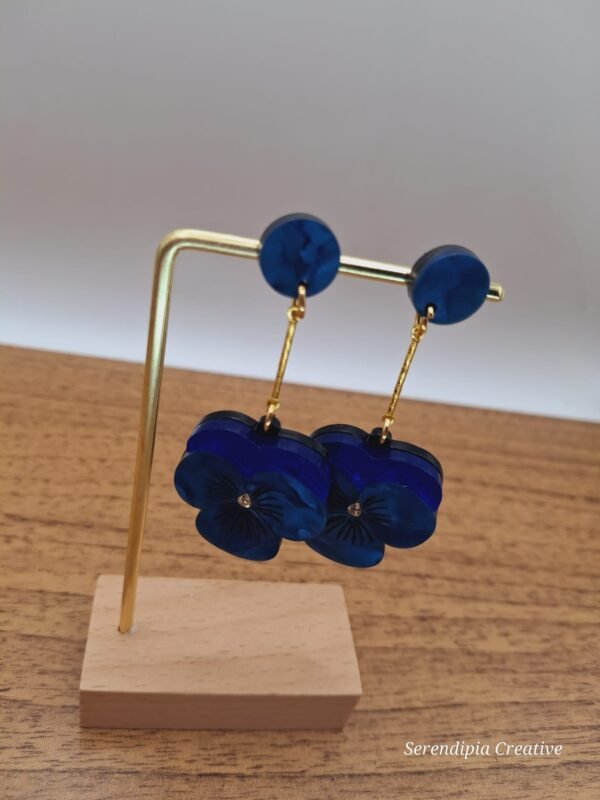 Pendiente pensamiento azul extensor